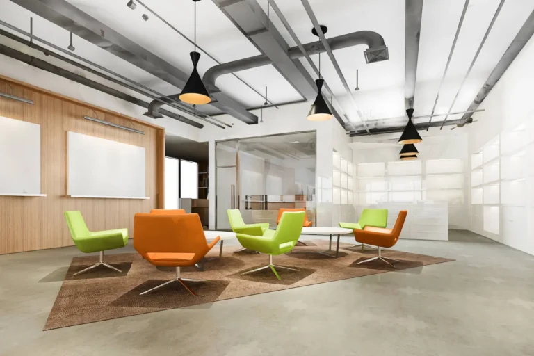 Modern office waiting area with colorful chairs and pendant lights.